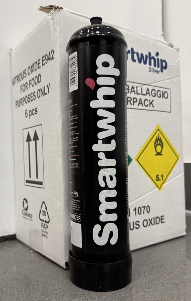 Warehouse stock of Cream Deluxe food-grade nitrous oxide cases